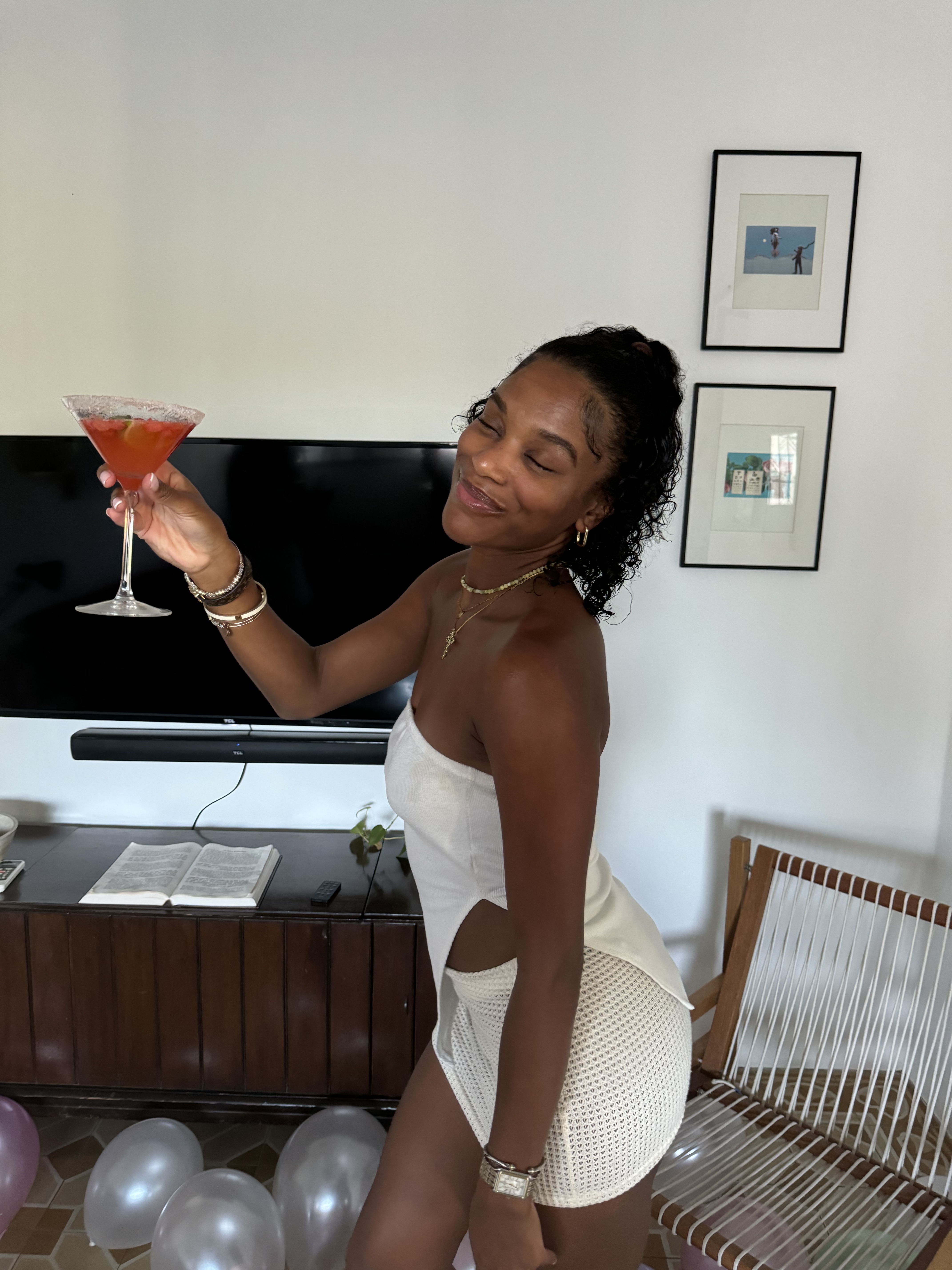 Khadija raising a mocktail in a toast